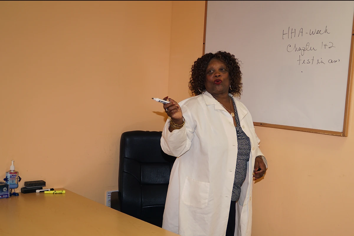 Class instructor at white board